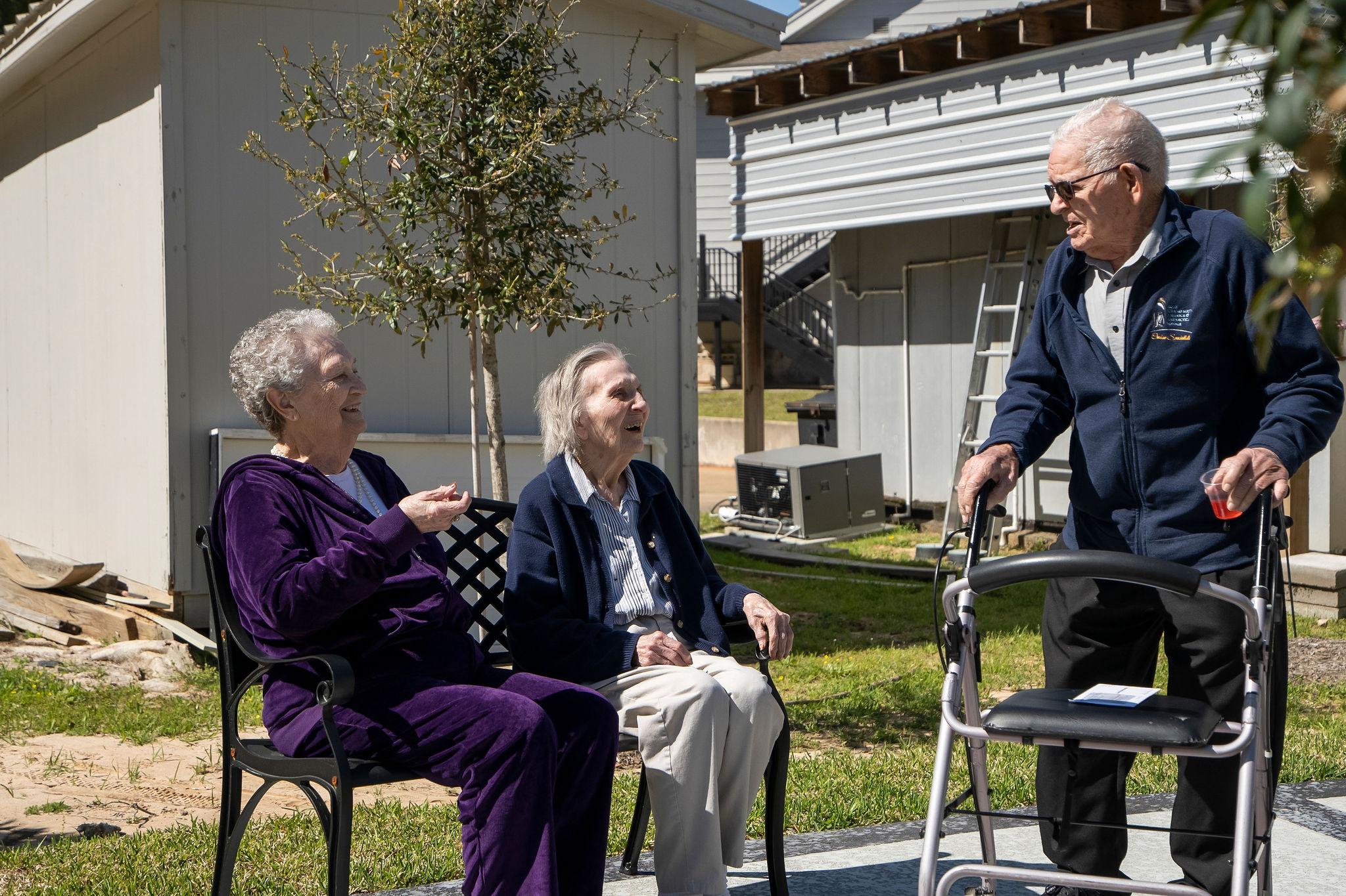 seniors in a community enjoying each other's company outside
