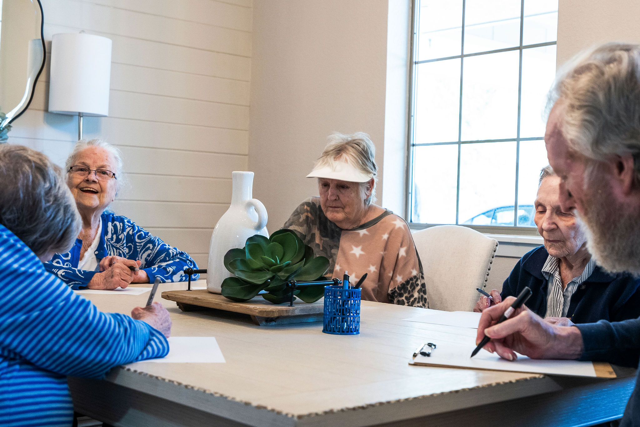 Residents of Sundale Senior Living in Huntsville, TX, playing a game together