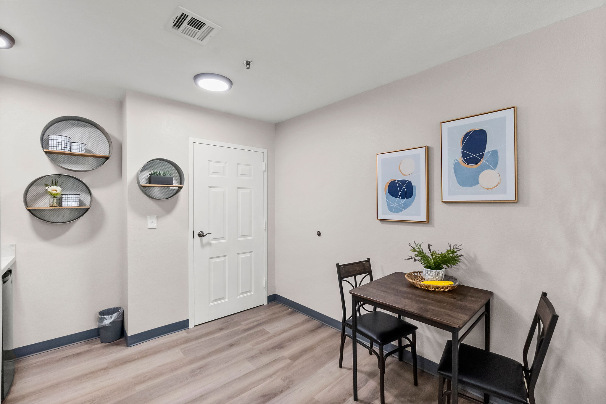 The eating area and entryway of an apartment at Sundale Senior Living in Huntsville, TX