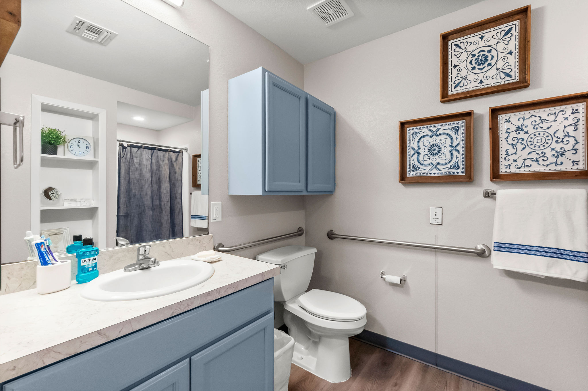 An updated vanity and toilet of the apartment-style living at Sundale Senior Living in Huntsville, TX